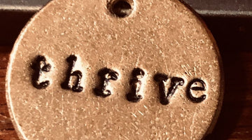 Thrive handmade bronze charm, a meaningful retirement gift from A Well Run Life