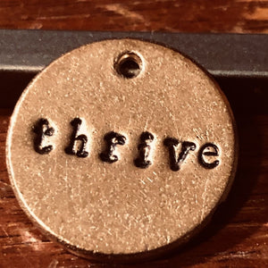 Thrive handmade bronze charm, a meaningful milestone birthday gift from A Well Run Life