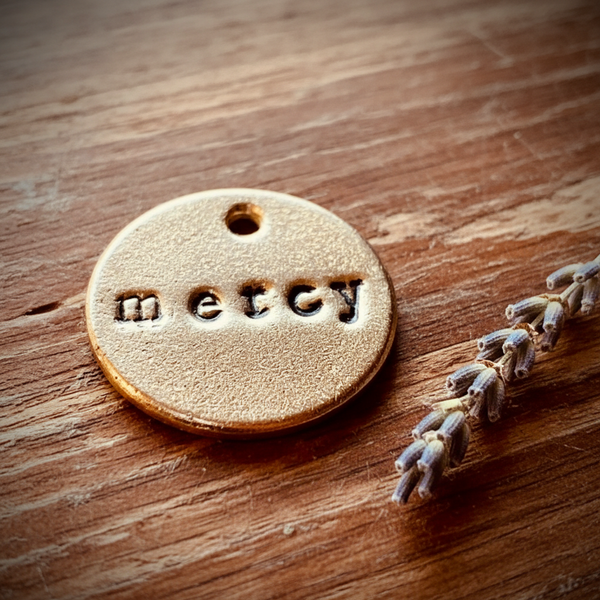 Mercy charm — hand-stamped bronze compassion gift, handmade in Arizona