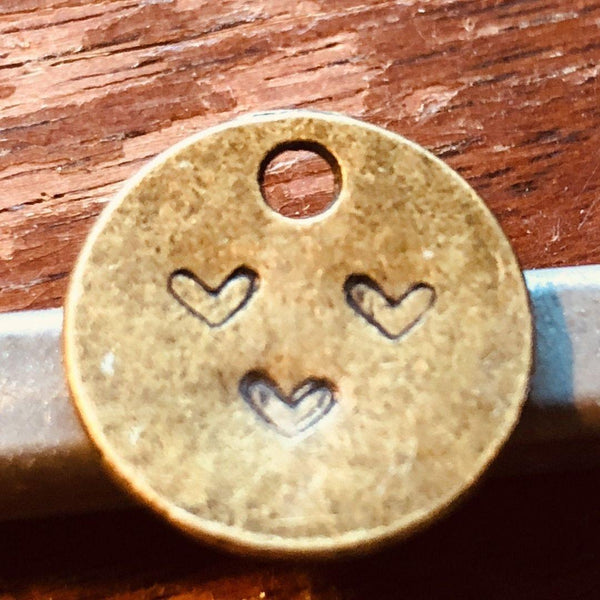 Teeny Tiny Itty Bitty Heart — dime-sized hand-stamped bronze heart charm